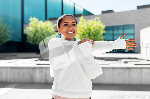 Image of african american woman doing sports outdoors