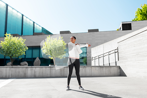 Image of african american woman doing sports outdoors