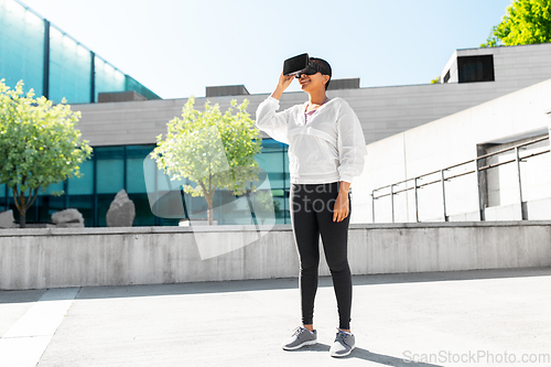 Image of happy african american woman with vr glasses