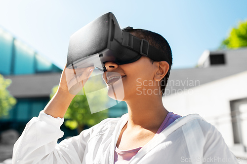 Image of happy african american woman with vr glasses