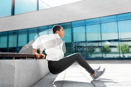 Image of african american woman doing sports outdoors