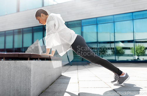 Image of african american woman doing sports outdoors