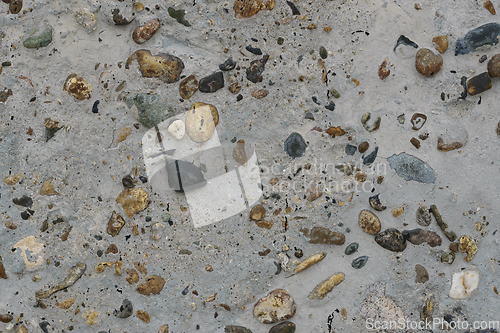 Image of Texture of concrete with multicolored pebbles on the surface