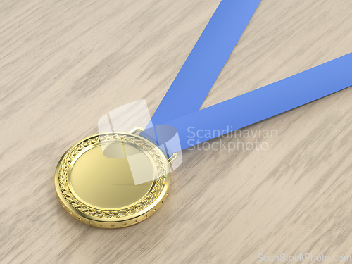 Image of Gold medal on wood background