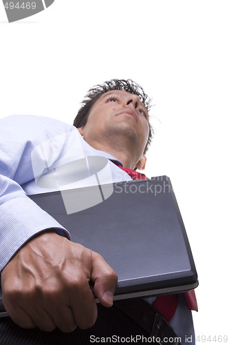 Image of businessman carrying a laptop