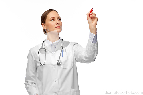 Image of female doctor writing with red marker