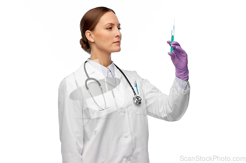 Image of female doctor with medicine in syringe