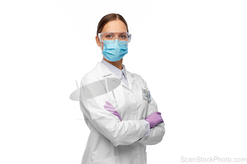 Image of female scientist in medical mask and goggles