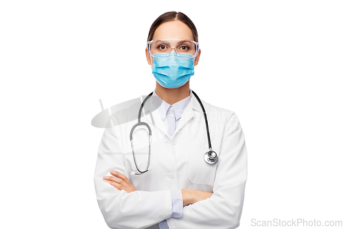 Image of female doctor in goggles and medical mask