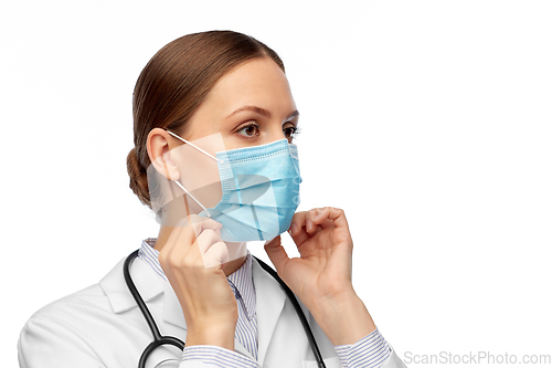 Image of happy female doctor wearing medical mask