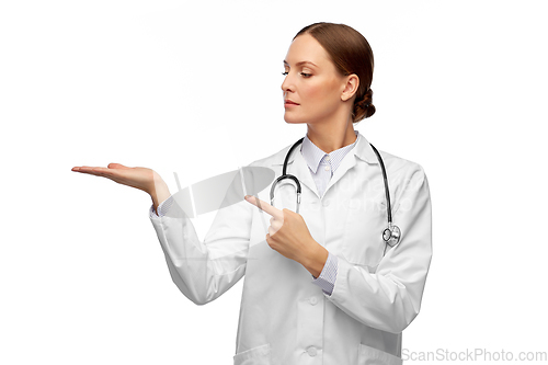 Image of female doctor holding something on her hand
