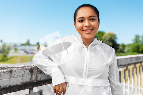 Image of african american woman in sports clothes outdoors