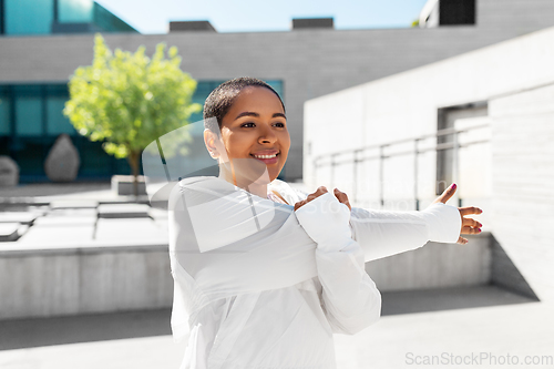 Image of african american woman doing sports outdoors