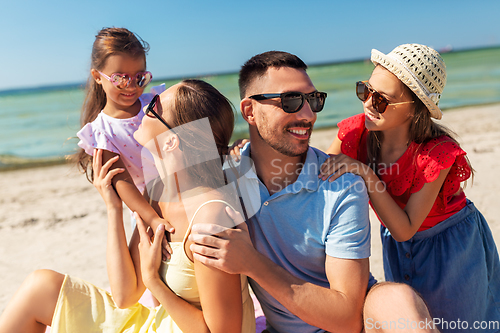 Image of happy family on summer beach