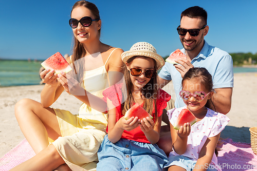 Image of happy family having picnic on summer beach