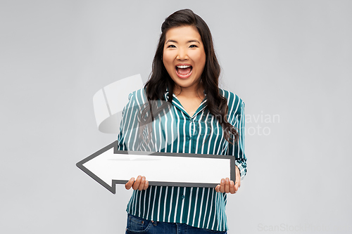 Image of happy smiling asian woman with leftward arrow