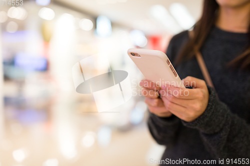 Image of Woman working on cellphone