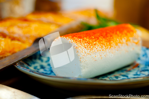 Image of French cheese and fresh  baguette on a wood cutter