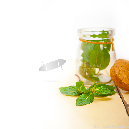 Image of fresh mint leaves on a glass jar