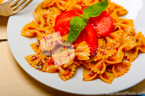 Image of Italian pasta farfalle butterfly bow-tie and tomato sauce