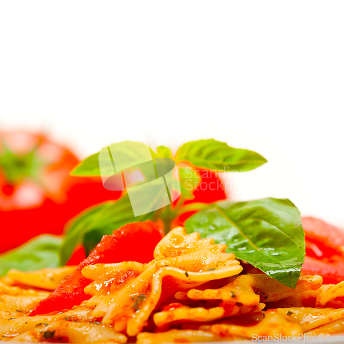 Image of Italian pasta farfalle butterfly bow-tie and tomato sauce