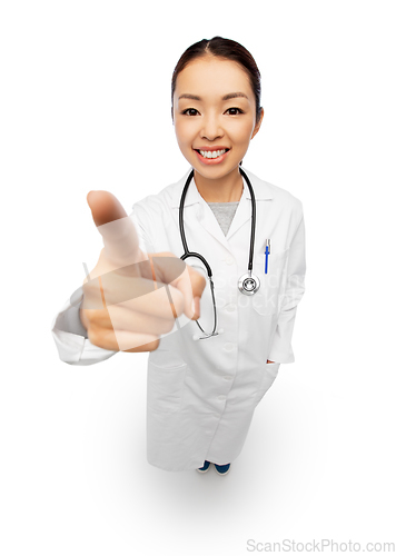 Image of happy asian female doctor pointing to camera