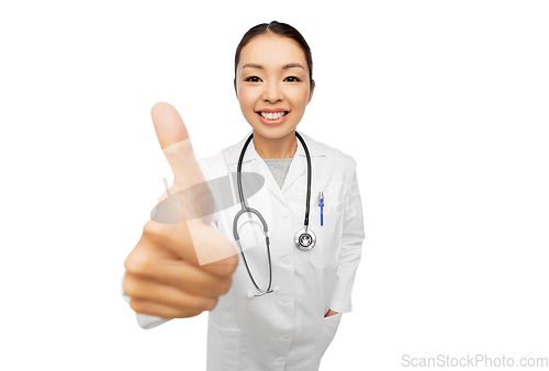 Image of smiling asian female doctor showing thumbs up