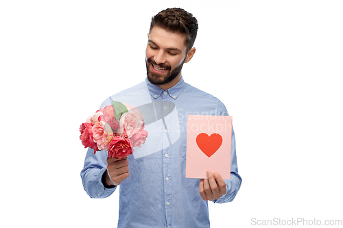 Image of happy man with flowers and valentine's day card