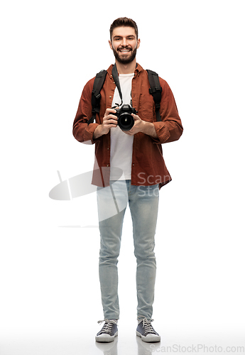 Image of happy man or photographer with camera and backpack