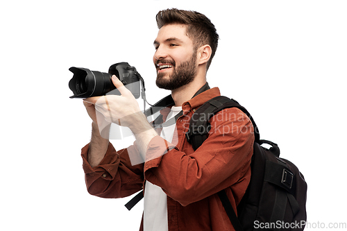 Image of happy man or photographer with camera and backpack