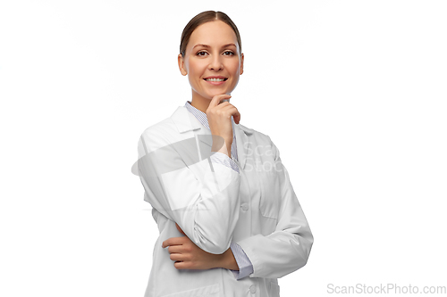 Image of thinking female doctor or scientist in white coat