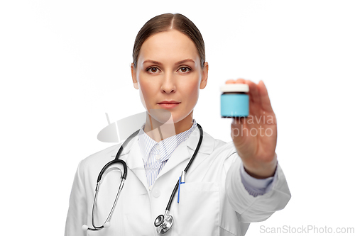 Image of female doctor holding jar of medicine