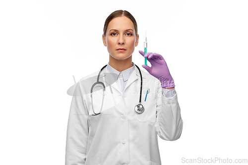 Image of female doctor with medicine in syringe