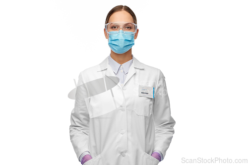 Image of female scientist in medical mask and goggles