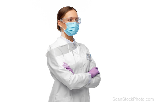 Image of female scientist in medical mask and goggles