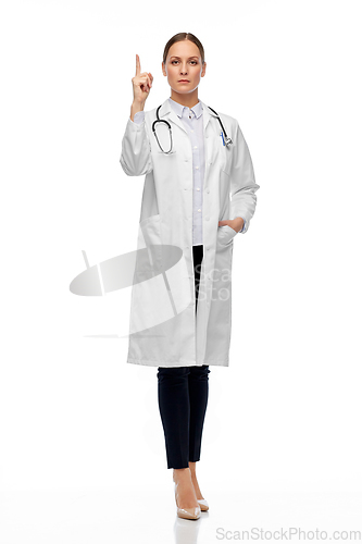 Image of female doctor with stethoscope pointing finger up