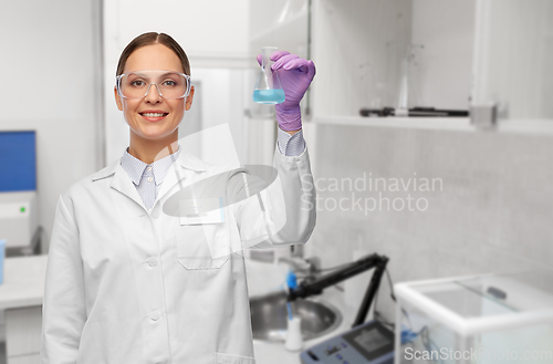 Image of female scientist with chemical at laboratory