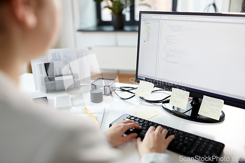 Image of businesswoman with computer working at office