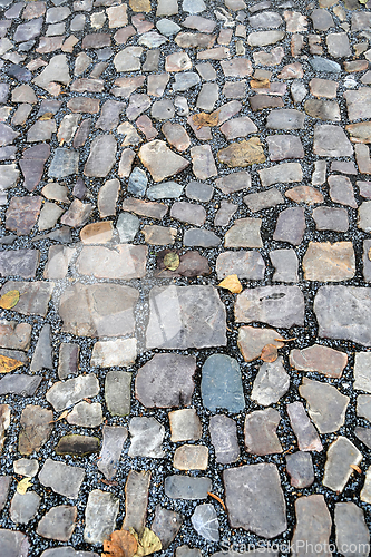 Image of Old pavement of stones of different colors and sizes