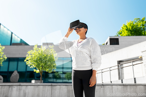 Image of happy african american woman with vr glasses