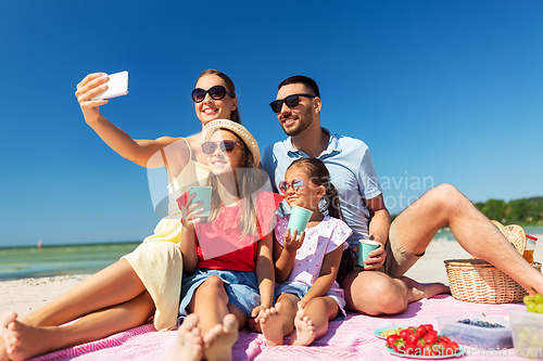 Image of happy family taking selfie on summer beach