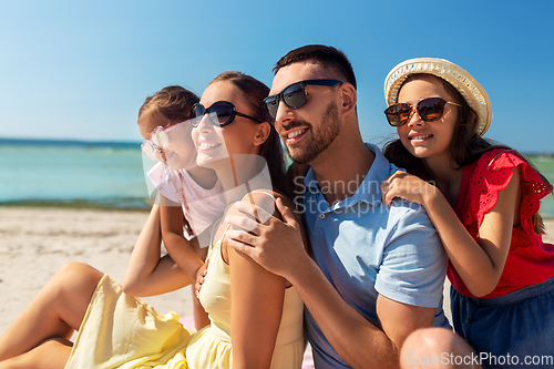 Image of happy family on summer beach