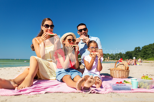 Image of happy family having picnic on summer beach