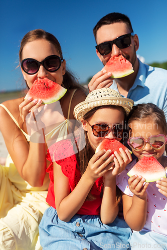 Image of happy family having picnic on summer beach