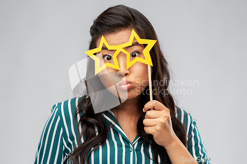 Image of asian woman with star-shaped party glasses