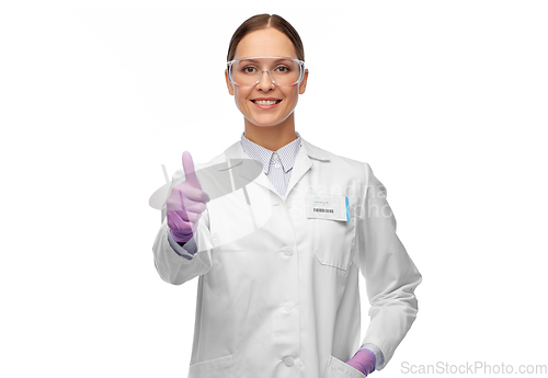 Image of female scientist in goggles showing thumbs up