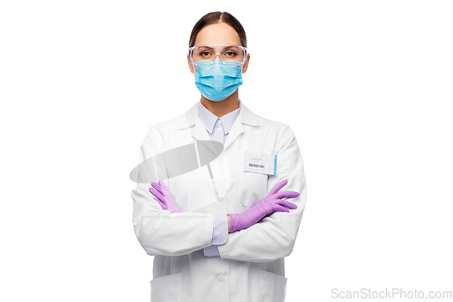 Image of female scientist in medical mask and goggles