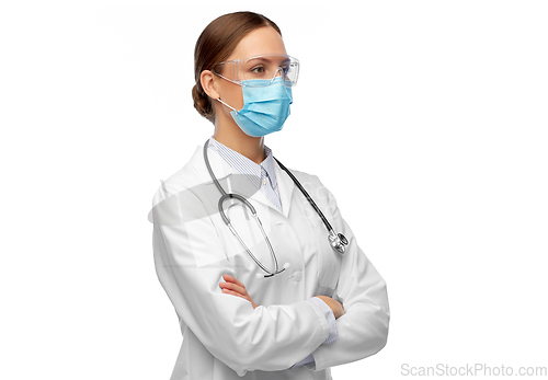 Image of female doctor in goggles and medical mask