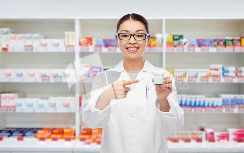 Image of asian female pharmacist or doctor with medicine