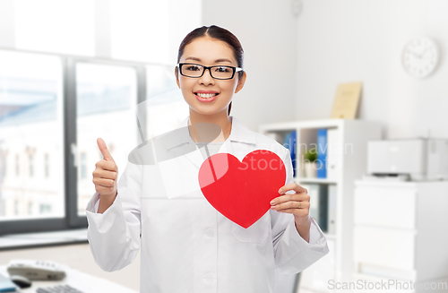 Image of asian female doctor with red heart at hospital